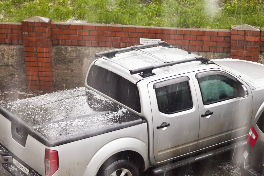 A truck hit by hail that will need an estimate on paintless hail dent repair costs in Austin, TX.