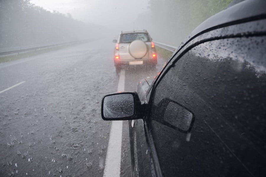 cars driving in a hailstorm