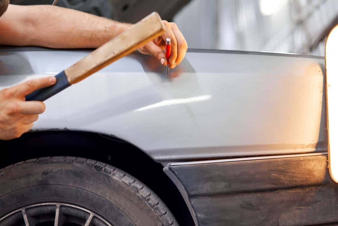 Close up of a PDR technician performing local dent repair in Cedar Park.