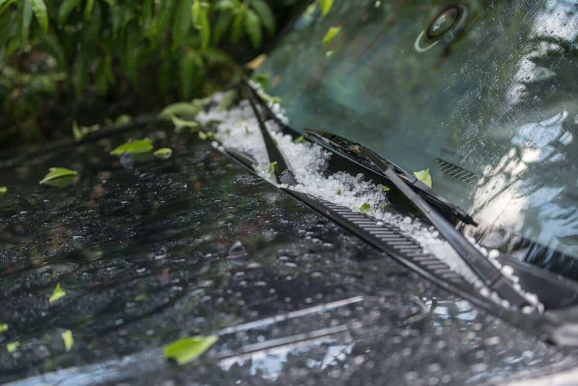 A car windshield and hood with hail damage with need for Cedar Park hail damage repair.