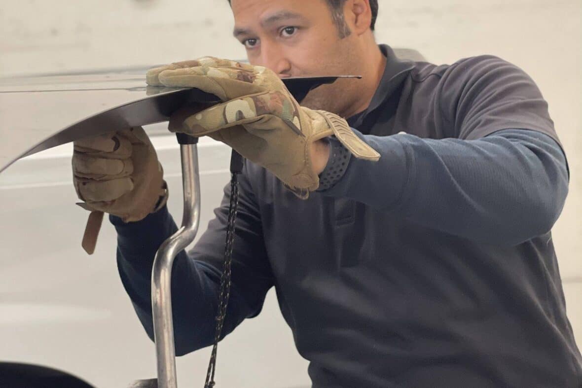 Professional Round Rock PDR tools including metal rods used for paintless dent removal